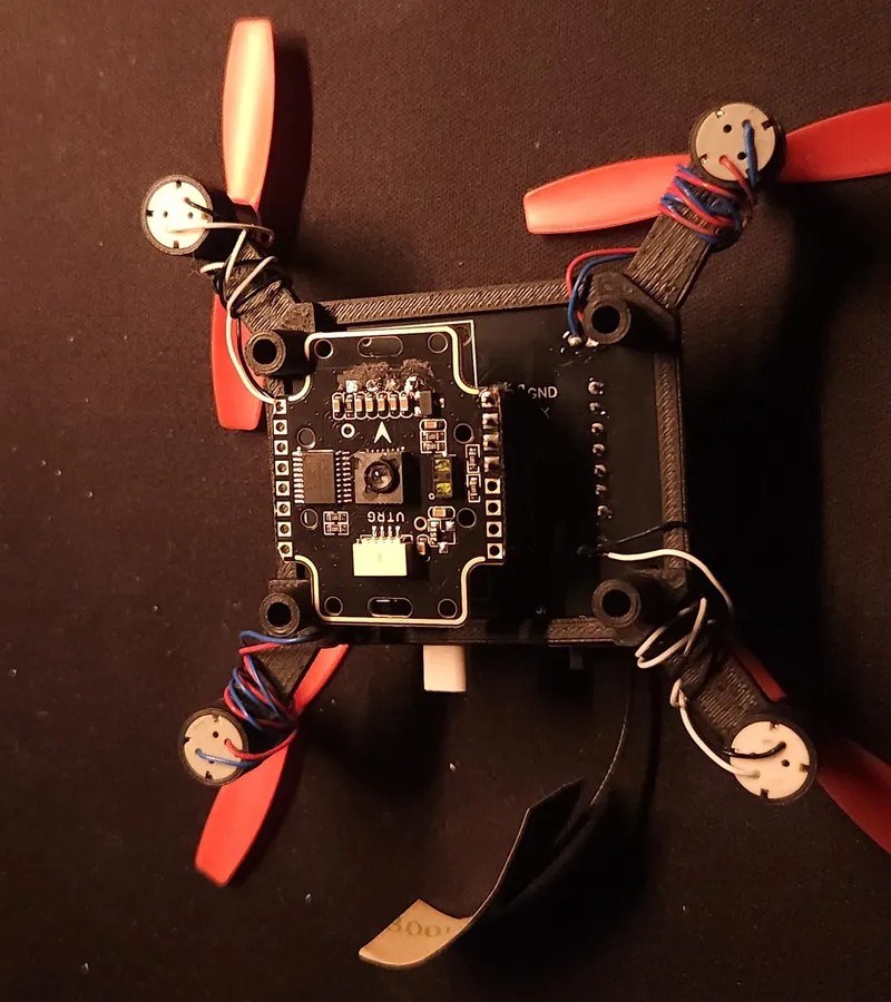Underside view: the downward-facing optical-flow module (Matek 3901-L0X — PMW3901 + VL53L1X ToF) on its own carrier PCB, for GPS-free position hold.