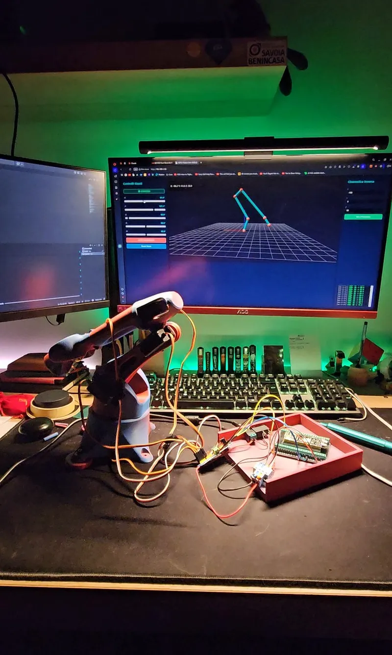 The physical arm and its live Three.js digital twin, both driven from the same Denavit-Hartenberg table — the on-screen pose tracks the real joints in real time, with direct joint sliders and the inverse-kinematics panel.