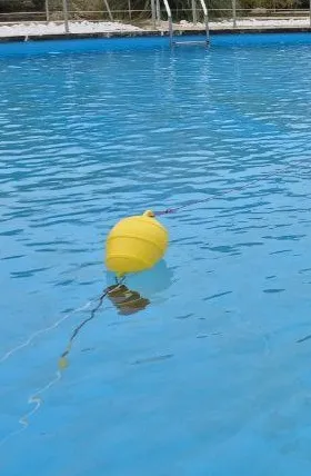 Surface buoy carrying the EvoLogics S2C USBL acoustic modem used for the range-only position update.